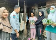 Lapas Suliki Bagikan Hasil Panen Caisim pada Warga